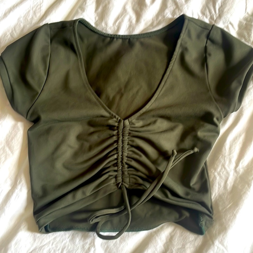 Crop top. Adjustable front.